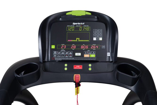 Close-up of a treadmill control panel with display and buttons.