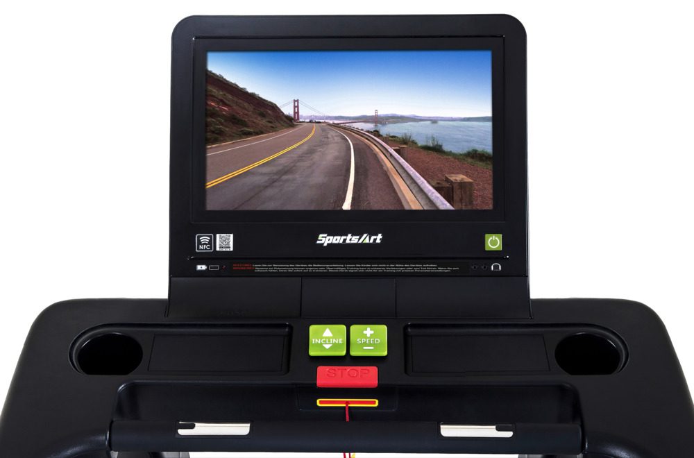 Treadmill console with a scenic road and bridge display.